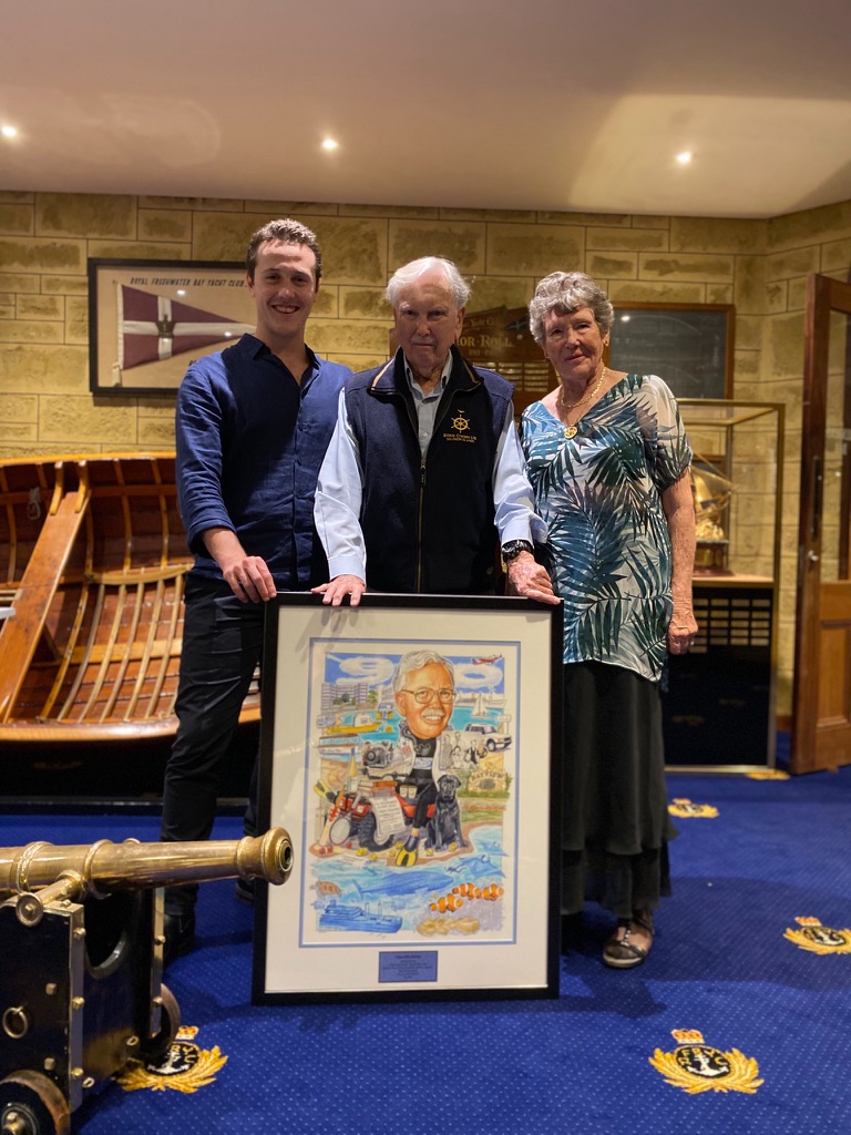 Me, my grandfather, and my grandmother at the yacht club, holding a framed caricature for his 90th birthday